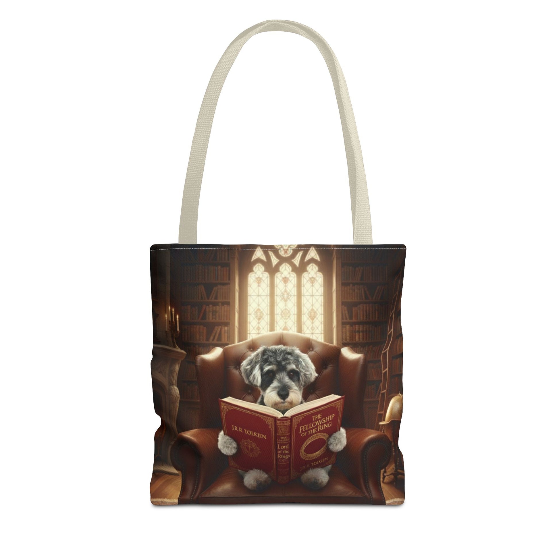 All-over print tote bag with beige handle, shown in 13"x13". Featuring an example bespoke scene of a dog reading a book, in an old library. We design unique art for you and your non-human family.