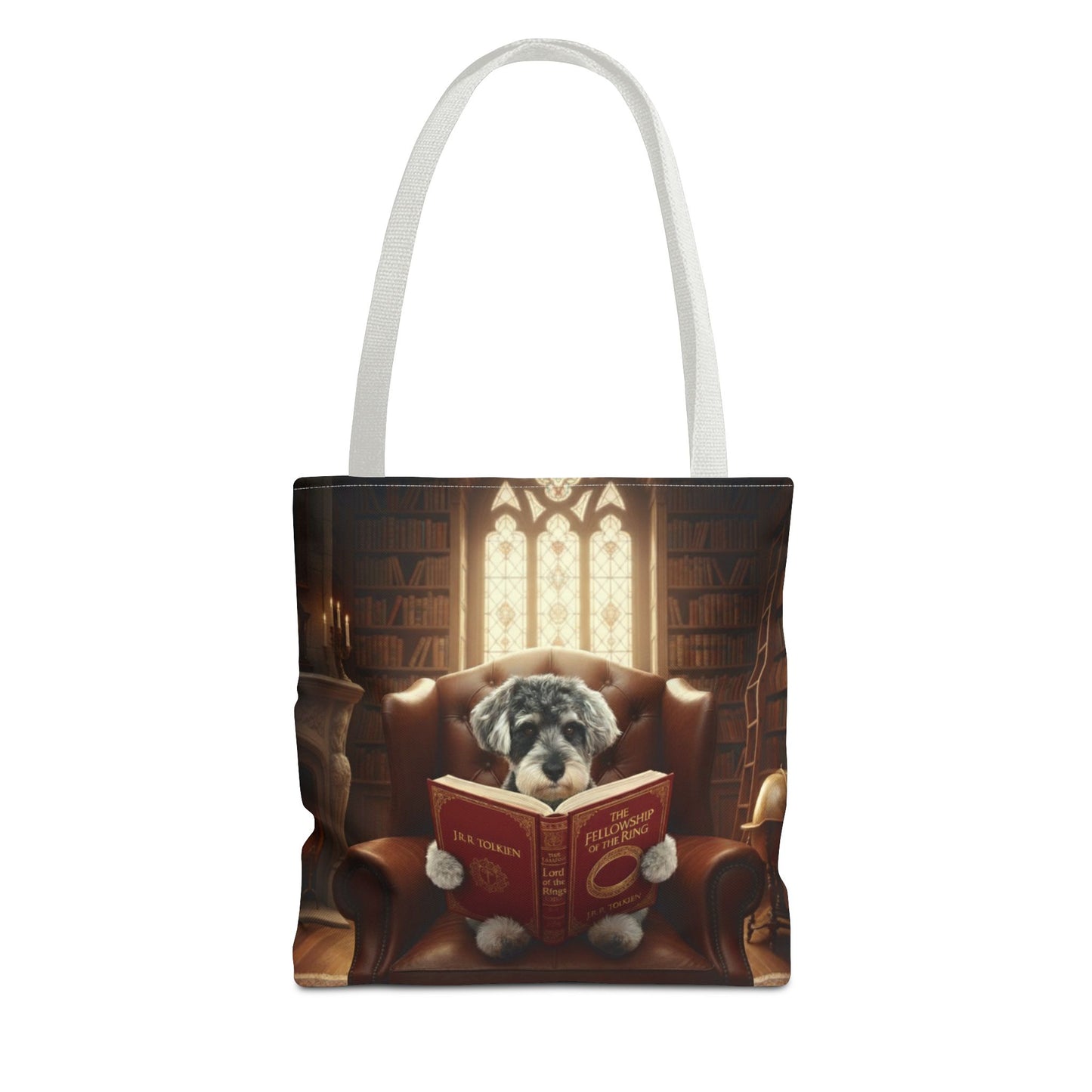 All-over print tote bag with white handle, shown in 13"x13". Featuring an example bespoke scene of a dog reading a book, in an old library. We design unique art for you and your non-human family.