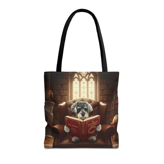 All-over print tote bag with black handle, shown in 16"x16". Featuring an example bespoke scene of a dog reading a book, in an old library. We design unique art for you and your non-human family.