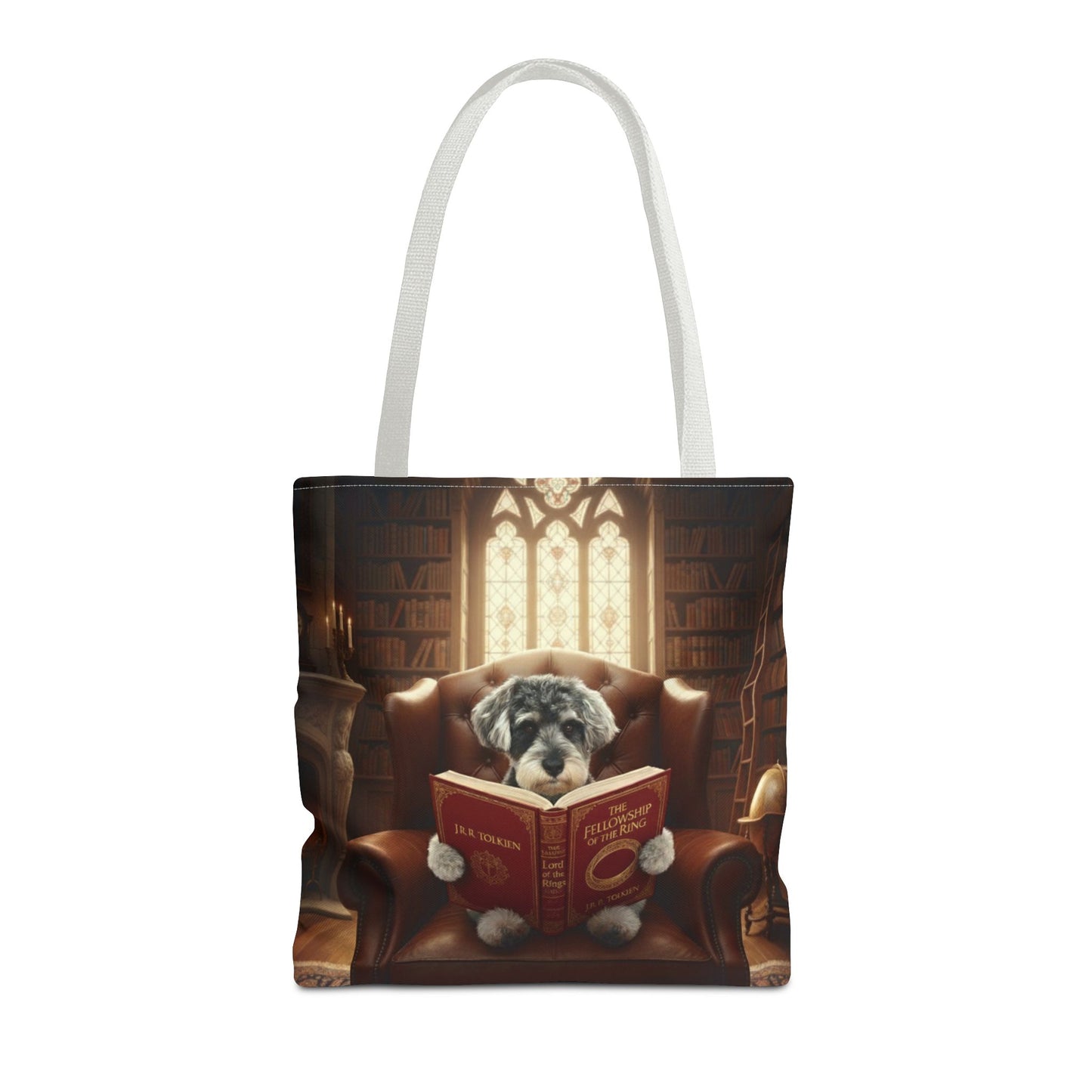 All-over print tote bag with white handle, shown in 16"x16". Featuring an example bespoke scene of a dog reading a book, in an old library. We design unique art for you and your non-human family.