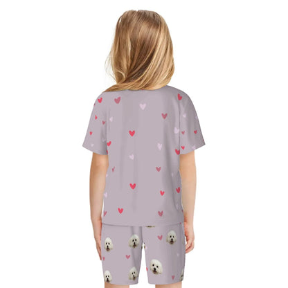 Back view of the personalized kids pajama shorts and t-shirt set. Example of a full-coverage bespoke print that includes custom background colors to honor your non-human family.