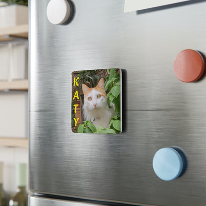 Custom pet art porcelain magnet displayed on a stainless steel refrigerator. A high-quality personalized gift designed for the devoted parent to celebrate their non-human family member.