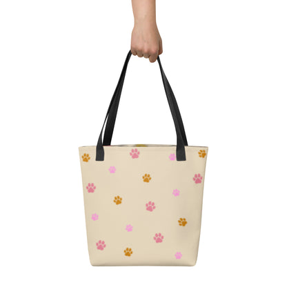 Rear view of the custom all-over print tote bag showing a pattern of paw prints. Every design is a bespoke example created to honor the unique bond with your non-human family.