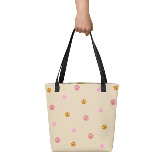 Rear view of the custom all-over print tote bag showing a pattern of paw prints. Every design is a bespoke example created to honor the unique bond with your non-human family.