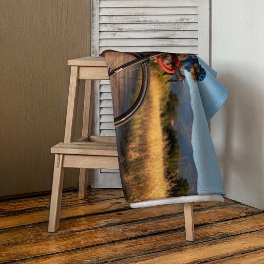 Custom pet art beach towel draped over a wooden stool. A unique, personalized gift idea for any pet lover and their cherished non-human family member.